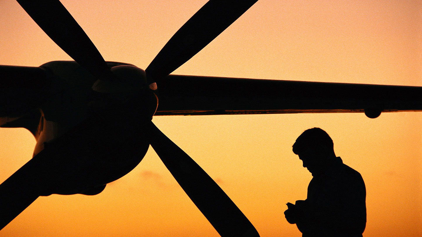 pilot next to plane